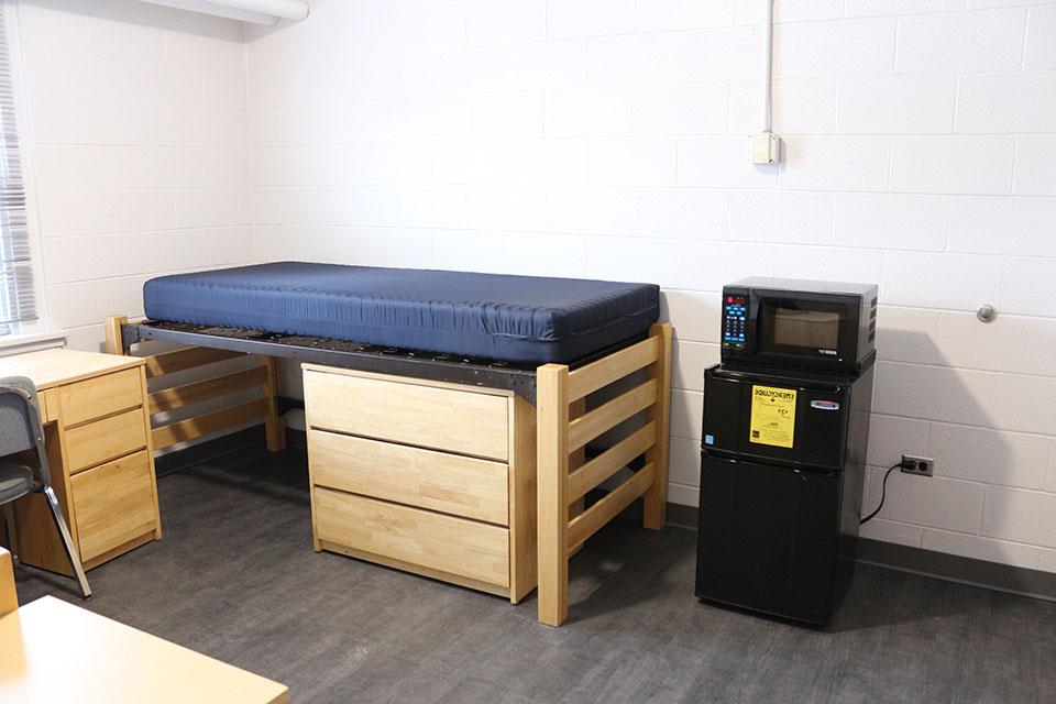 Student bed, desk and micro fridge arrangement